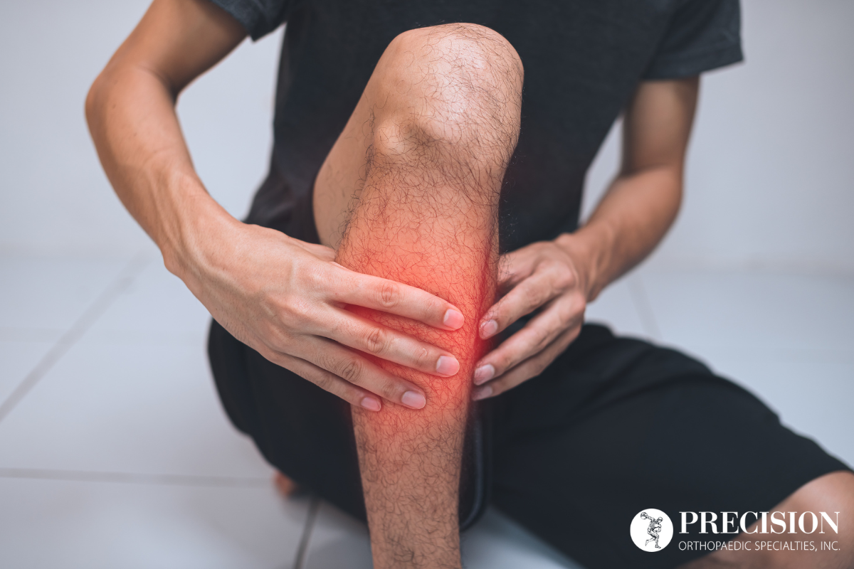A man holding his leg in pain caused by a shin splint in Chardon, Ohio.