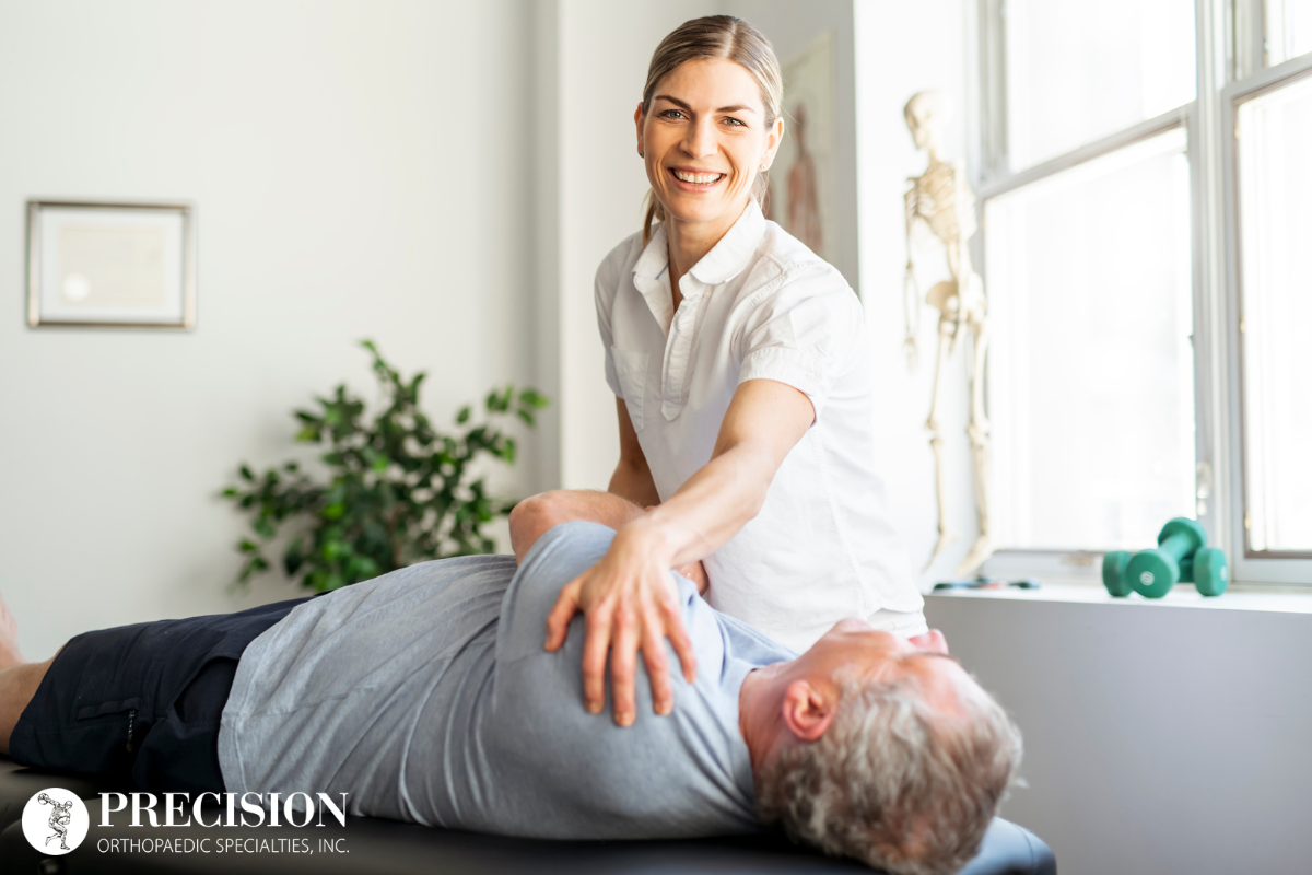 A chiropractor treating a patient with shoulder pain in Ohio.