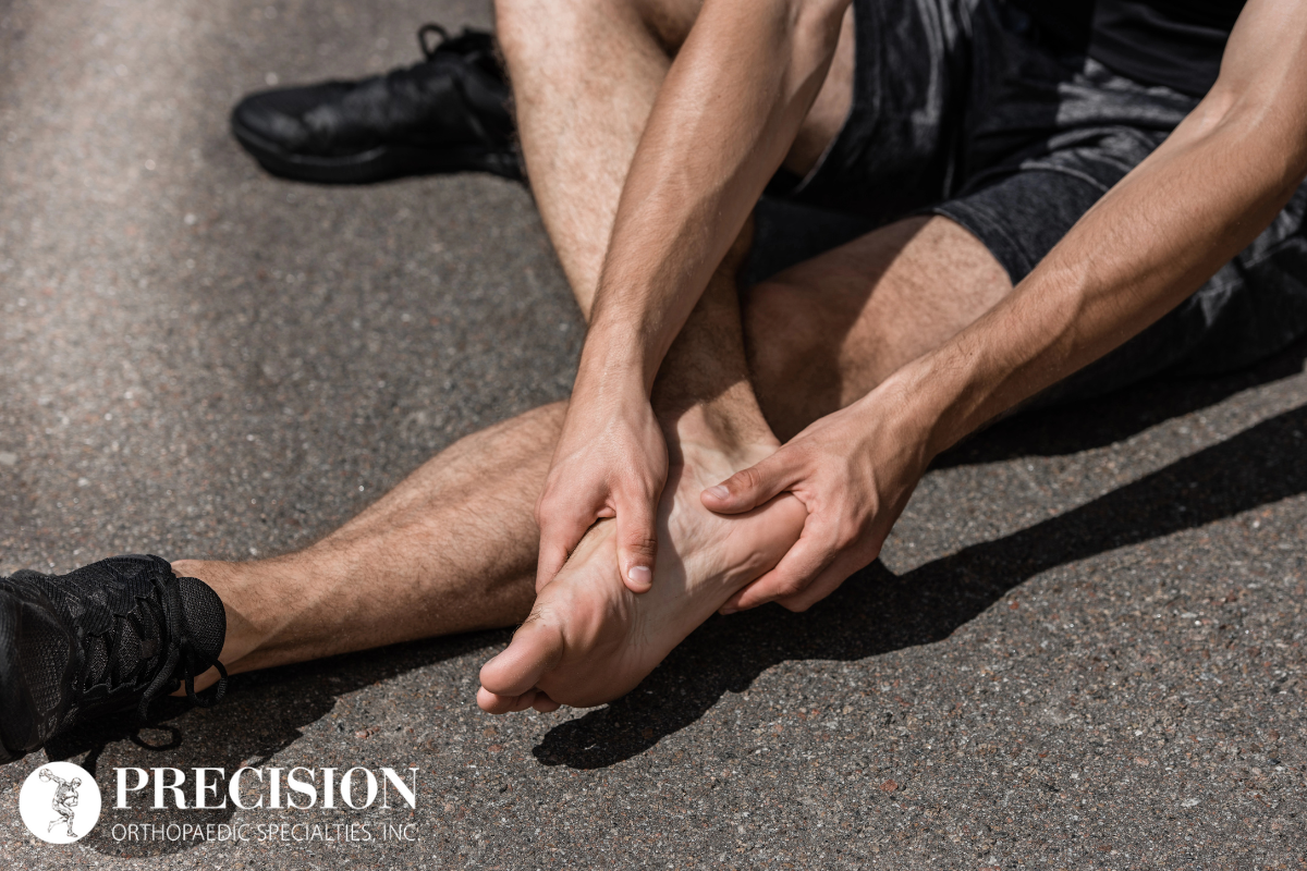 A man with foot pain caused by Plantar Fasciitis in Ohio.